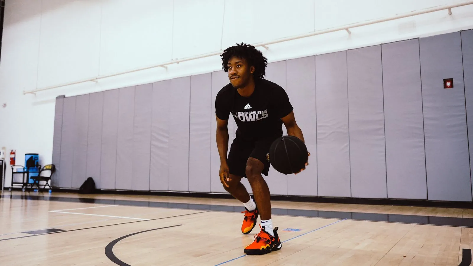Player working on ball handling in the gym